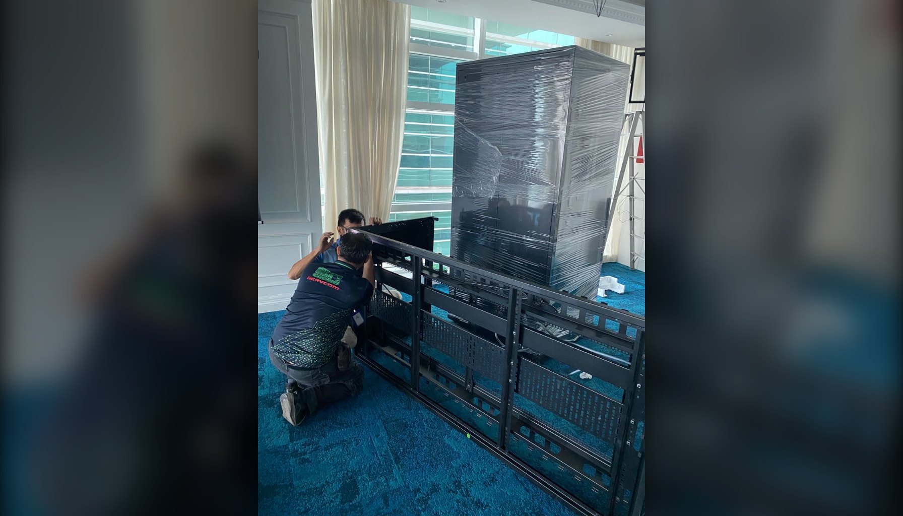 Servcom engineers dismantling a server rack during a server relocation in Kuala Lumpur